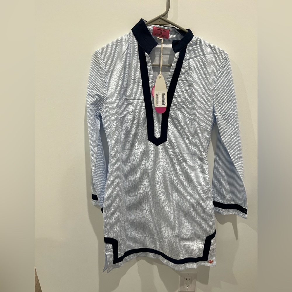 Blue and white pinstriped dress but can be used as cover up over bathing suit.